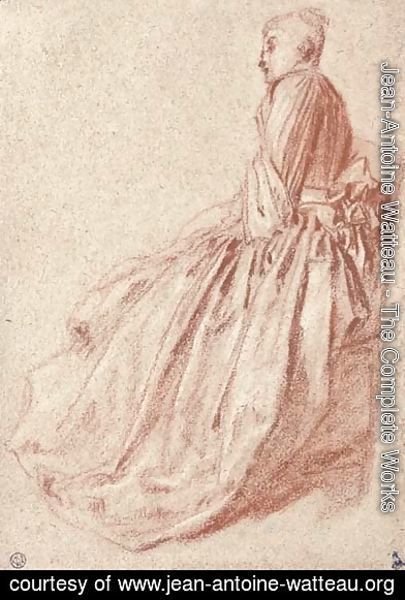 A woman in a long dress, seated in profile to the left